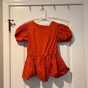 Red top with puffy sleeves